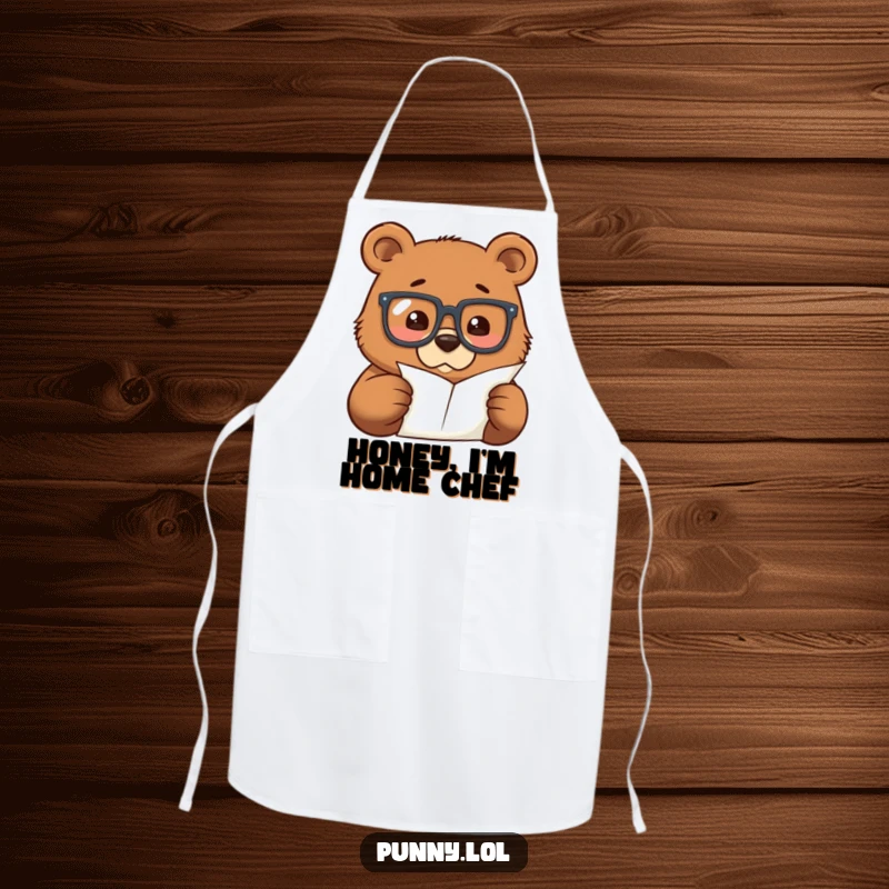 Funny apron with a bear wearing oversized glasses, examining a tiny recipe paper, ready for kitchen experiments.