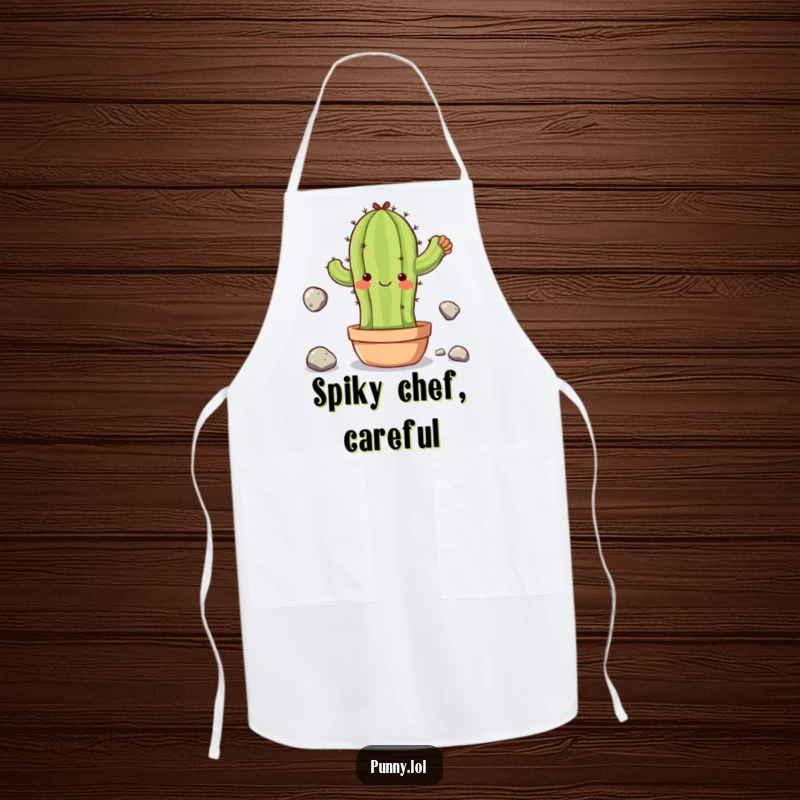 Funny apron with a clumsy cactus character juggling stones, designed for cooks who appreciate humor and embrace a little bit of controlled chaos.