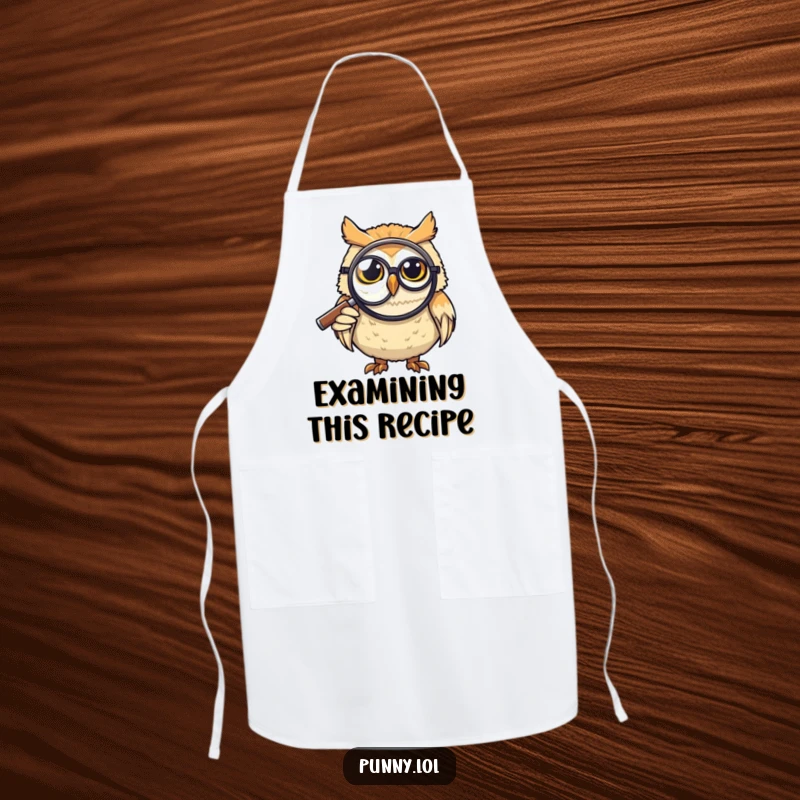 Funny Apron: A grinning owl wearing a monocle uses a giant magnifying glass, adding humor to kitchen tasks, a perfect funny gift.