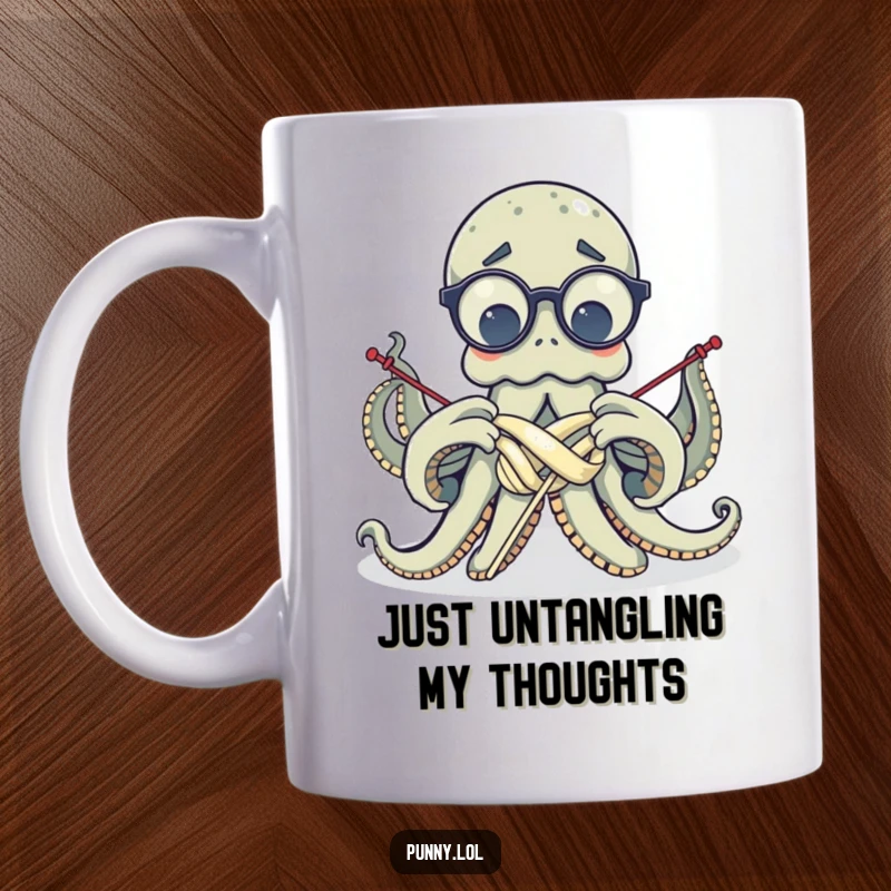 Funny, confused octopus wearing glasses, attempting to knit with all eight arms tangled, depicted on a humorous mug.