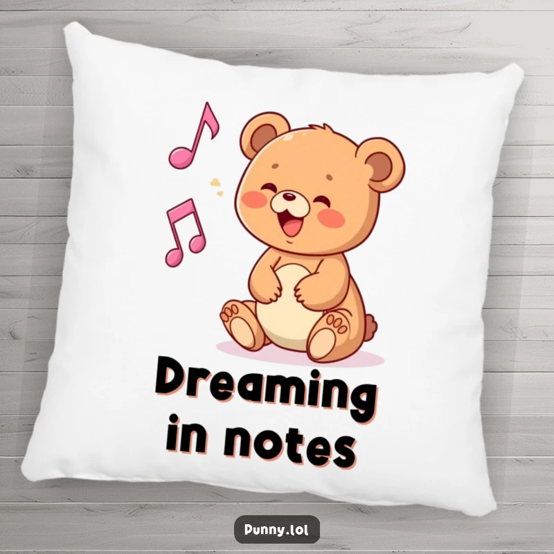 Funny pillow featuring a delighted bear cub interacting with a musical note, for cozy music lovers.