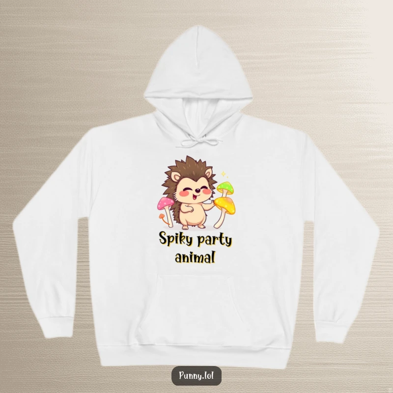 Funny hoodie depicting a happy hedgehog juggling colorful glowing mushrooms, radiating joy and warmth.