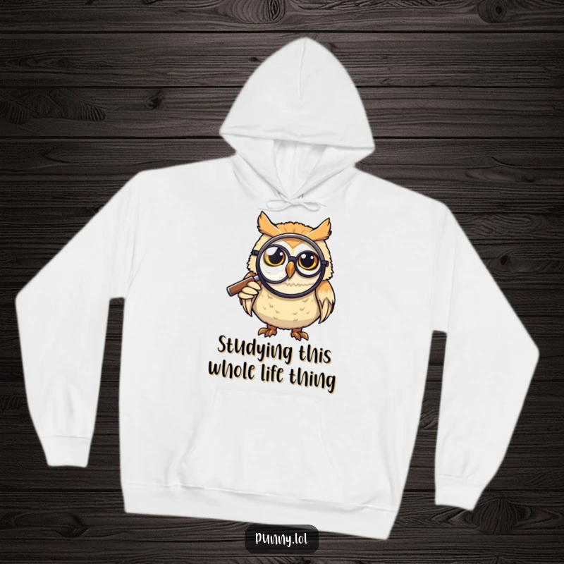 Funny Hoodie: A grinning owl with a monocle examines something closely with a large magnifying glass, a humorous design for a funny gift.
