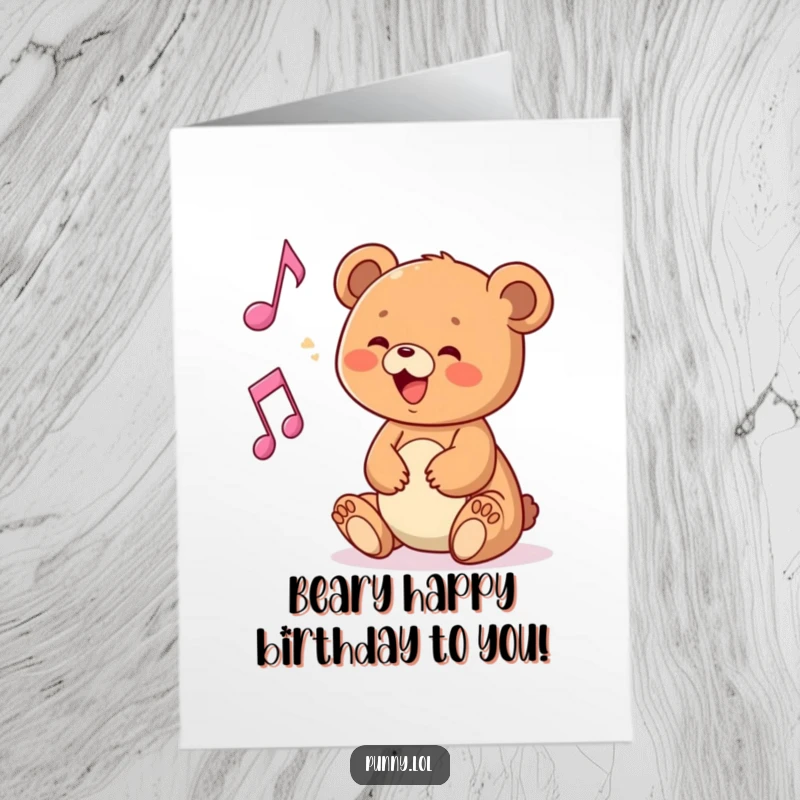 Funny Free Printable Birthday Card featuring a happy bear cub playing with a floating musical note, spreading birthday cheer.