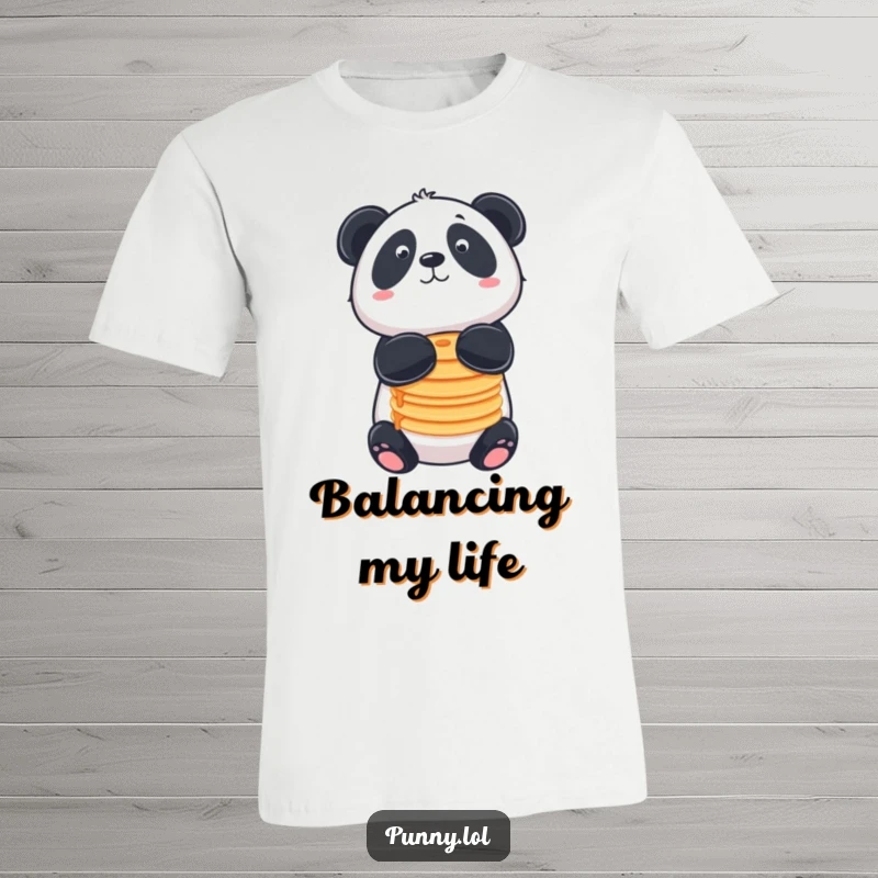 Funny t-shirt featuring a panda balancing pancakes on its nose, ideal for breakfast lovers.