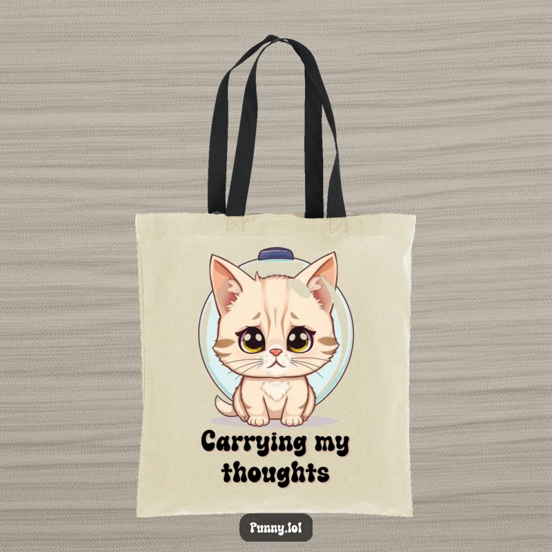Funny tote bag showcasing a confused cat trying to wear a fishbowl as a helmet, a humorous accessory.