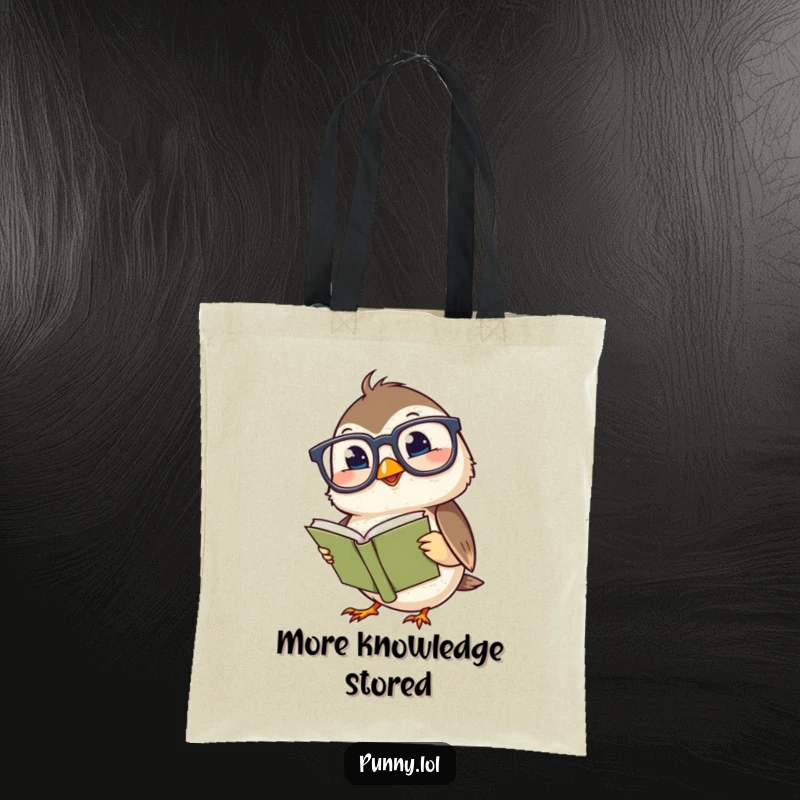 Funny tote bag featuring a giggling chickadee wearing large glasses, reading a miniature book, ideal for bookish errands.
