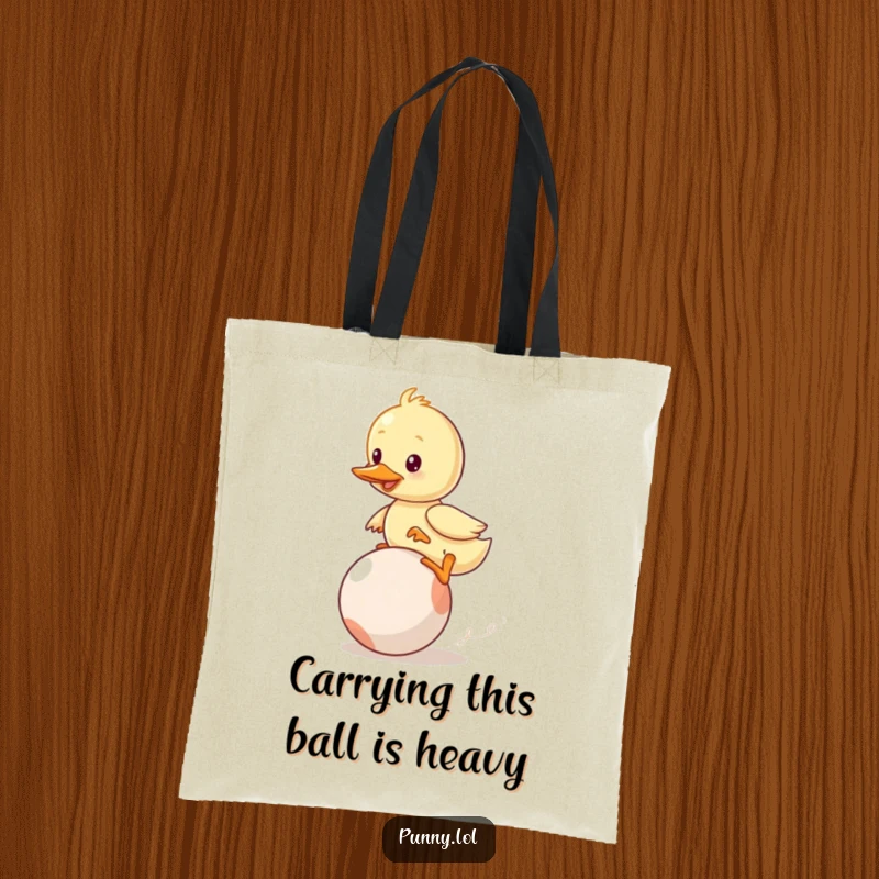 Funny Duckling Tote Bag: A wobbly duckling hilariously attempts to balance on a bouncing ball, highlighting comical effort in a charming way.